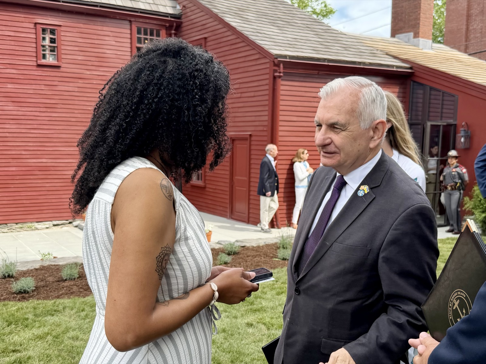 Jack Reed speaking with a constituent at a community event